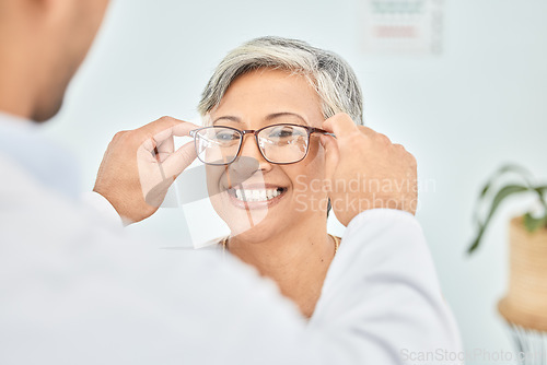 Image of Eye care, glasses and senior patient with doctor, optometry and frame choice with help and people at clinic. Wellness, health and prescription lens, woman and optometrist with trust and eyewear