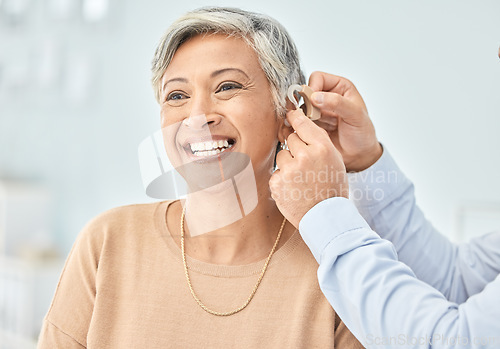 Image of Senior patient, hearing aid and doctor hands, ear and listening, help and trust, healthcare and medicine. Medical tech, consultation with ENT specialist and health, happy woman and people at clinic