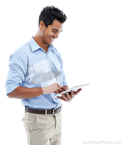 Image of Connected to social media 247. Studio shot of a handsome young man using a digital tablet isolated on white.