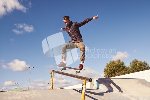 Image of Like flying. Shot of a skateboarder performing a trick on a rail.