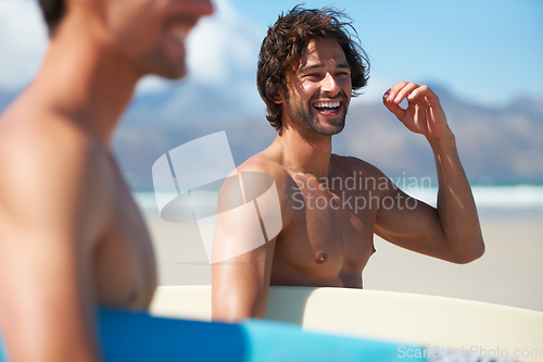 Image of Excited for some surfing. Two friends making their way to the ocean, joking along the way.