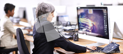 Image of Just another busy day in the office. Cropped shot of two businesswomen working in an office.