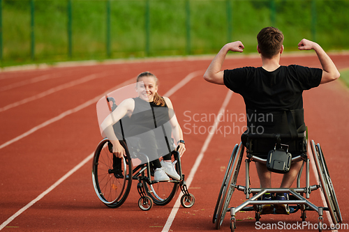 Image of An inspiring couple with disability showcase their incredible determination and strength as they train together for the Paralympics pushing their wheelchairs in marathon track