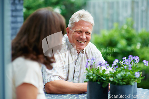 Image of Time to relax. Cropped shot of a senior couple sitting outside.