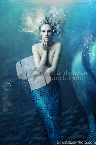 Image of Shot of a mermaid swimming in solitude in the deep blue sea - ALL design on this image is created from scratch by Yuri Arcurs team of professionals for this particular photo shoot