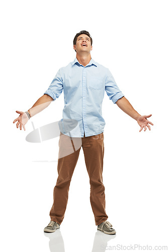 Image of Seriously. A young man looking to the skies with his arms open - isolated.