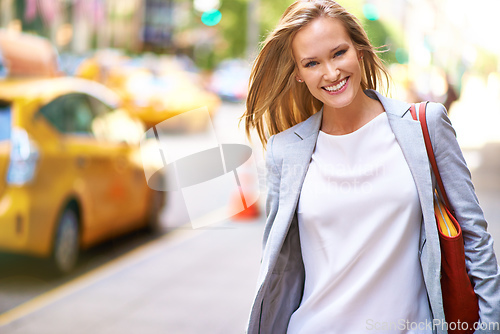 Image of Out and about. A gorgeous young woman with her handbag in New York.