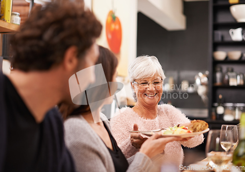 Image of Friends and family are the true gifts in life. Shot of a family sitting down to dinner.