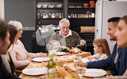 Image of They always get together on special occasions. Cropped shot of a family sitting down to dinner.