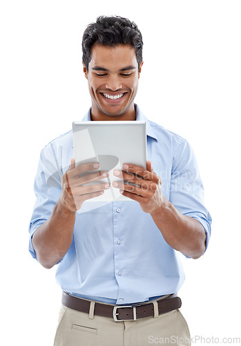 Image of Connected to social media 247. Studio shot of a handsome young man using a digital tablet isolated on white.