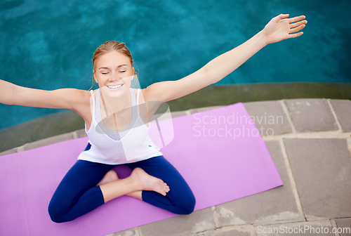 Image of Yoga is a way to freedom. Shot of a young woman doing yoga outdoors.