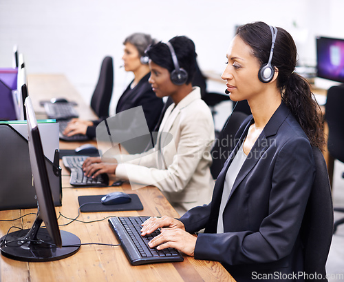Image of Theyve always provided great service. Cropped shot of three female call center representatives wearing headsets.