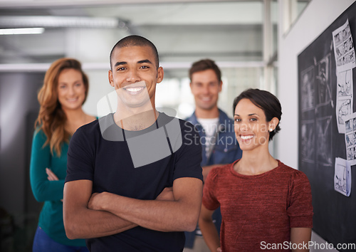 Image of Their combined minds create a great team. Cropped portrait of a team of young creative professionals standing in the office.