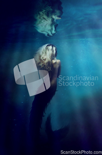 Image of Underwater goddess. A gorgeous mermaid underwater - ALL design on this image is created from scratch by Yuri Arcurs team of professionals for this particular photo shoot.