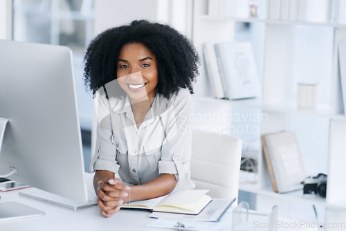 Image of Im so proud of every success Ive made. Portrait of a young businesswoman working in an office.