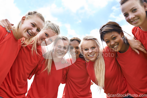 Image of We are ready to win. Portrait of an all-girls soccer team standing arm in arm outside.