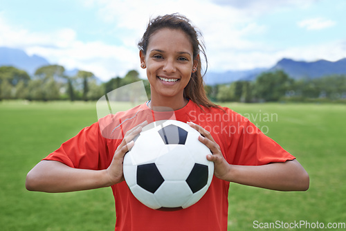 Image of In it to win. Shot of a young female soccer player holding a soccer ball.