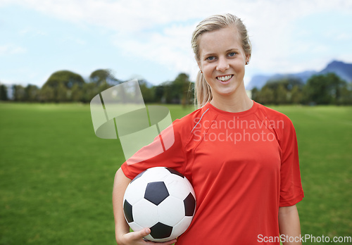 Image of In it to win. Shot of a young female soccer player holding a soccer ball.