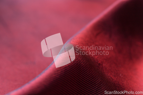 Image of Closeup of red satin fabric