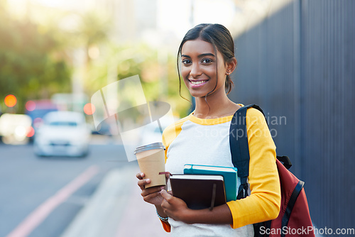 Image of Ive got my books and coffee, Im ready for college. Cropped shot of a young female student commuting to college in the city.