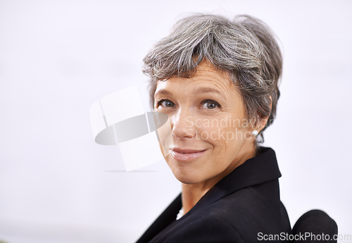 Image of Its good to be the boss. Portrait of a mature businesswoman sitting indoors.