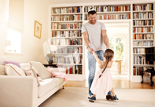 Image of Can I have this dance with you. Shot of a father dancing with his little daughter at home.