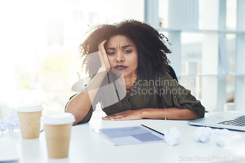 Image of Running out of ideas is normal, just never give up. Portrait of a young businesswoman sitting at her office desk looking tired and stressed out.