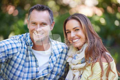 Image of Just us, no distractions. Portrait of an affectionate couple sitting outside.