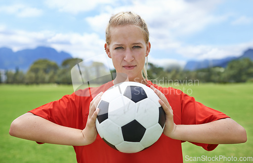 Image of Getting focused for the game. Portrait of a determined young female soccer player.