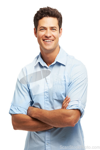 Image of Hes naturally confident. Portrait of a handsome young man standing with his arms folded.