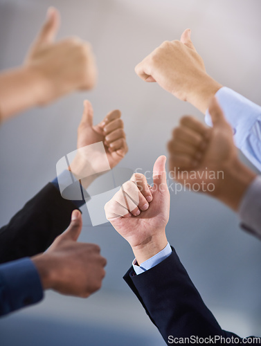 Image of Inspiration is contagious, pass it on. Cropped shot of a group of businesspeople showing a thumbs up gesture.