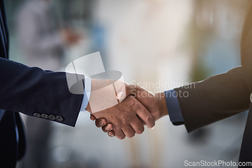 Image of Partners in profit. Cropped shot of two businessmen shaking hands.