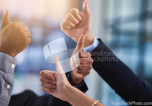 Image of Were rooting for you. Cropped shot of a group of businesspeople showing a thumbs up gesture.