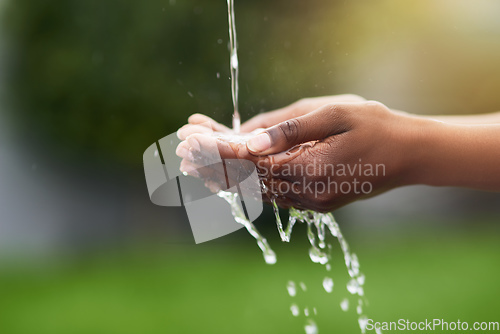 Image of Water...the source of all life. Cropped shot of a woman washing her hands outdoors.