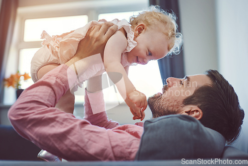 Image of Nothing makes me happier than being your dad. Shot of a young man spending quality time with his adorable daughter at home.