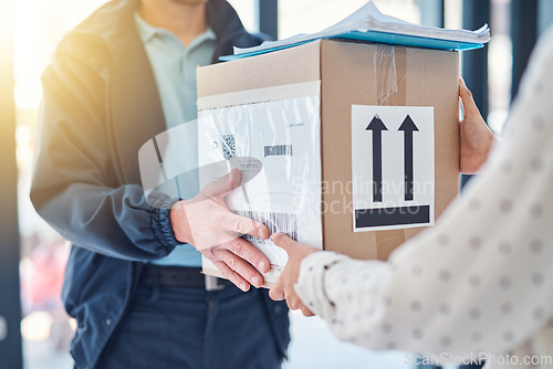 Image of Delivered, directly into your hands. Cropped shot of an unrecognizable delivery man handing a package to a female customer.