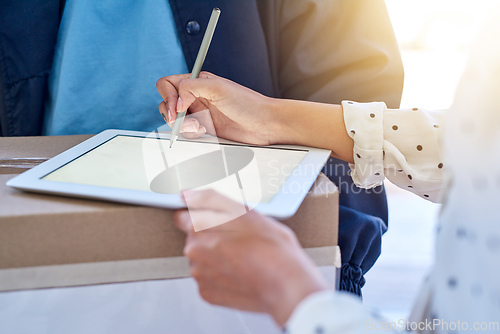 Image of Making deliveries even more convenient. Cropped shot of an unrecognizable delivery man getting a signature from a female customer for her order.