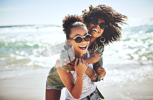 Image of We missed the beach. Shot of two girlfriends enjoying themselves at the beach.