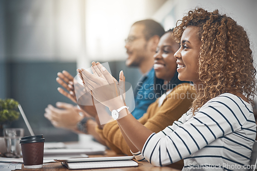 Image of Thats what you call a good meeting. Shot of a group of business people clapping hands.