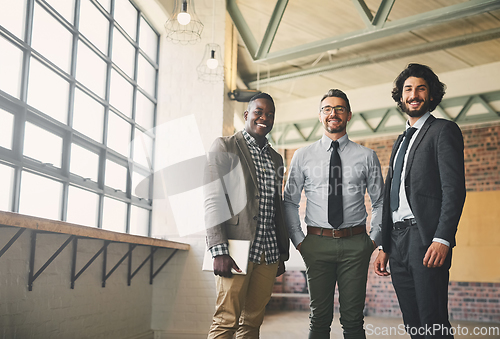 Image of Were taking the business world by storm. Portrait of three professional businessmen posing together in their office.