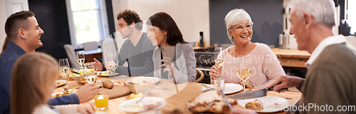 Image of Friends and family are the true gifts in life. Shot of a family sitting down to dinner.