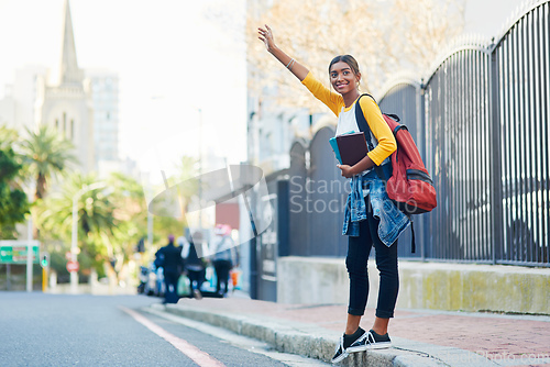 Image of Got to catch a cab on my way to college. Shot of a young female student commuting to college in the city.