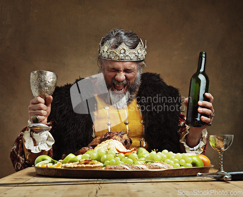 Image of Im the life of the party. A mature king feasting alone in a banquet hall.