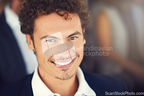 Image of Happy to here and eager to learn. Portrait of a handsome young businessman attending a seminar.