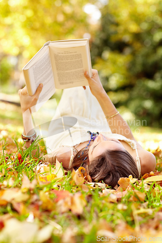 Image of Autumn beauty. Shot of an attractive young woman in the park on an autumn day.
