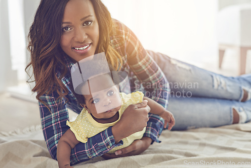 Image of Shes my everything. Cropped shot of a young mother and her little baby girl at home.