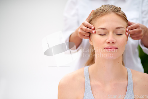 Image of Massaging the stress away. Cropped shot of a young woman enjyoing a massage at the day spa.