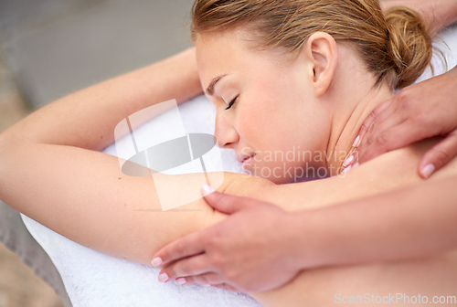 Image of Every woman deserves to be pampered. Cropped shot of a young woman enjyoing a massage at the day spa.