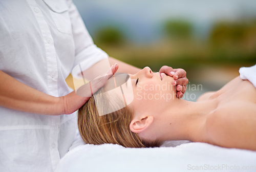 Image of Simply blissful. Cropped shot of a young woman enjyoing a massage at the day spa.