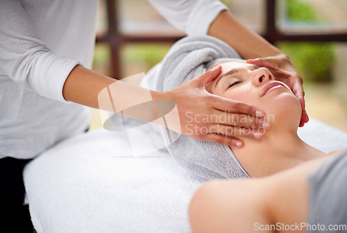 Image of Getting rid of all the tension. Cropped shot of a young woman enjyoing a massage at the day spa.